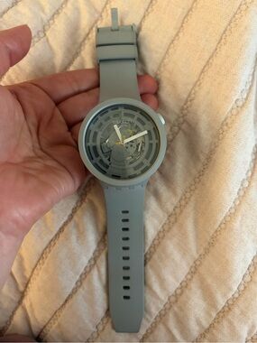 Swatch light grey skeleton dial